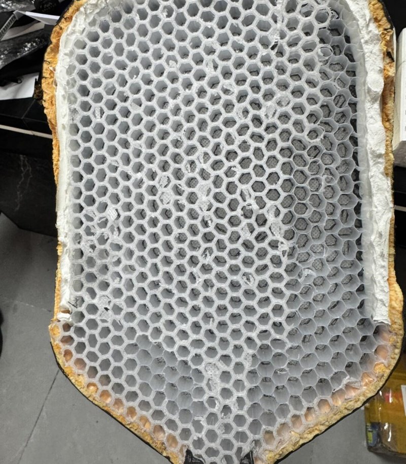 Detailed honeycomb core design of a pickleball paddle Close-up view of a pickleball paddle's honeycomb core structure during manufacturing.