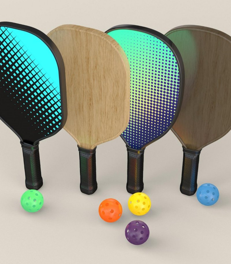 Pickleball Paddles and Balls Pickleball paddles with colorful designs and balls