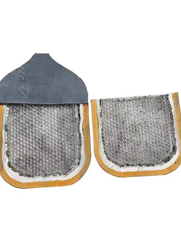 Pickleball paddle cross-section highlighting honeycomb core design Cross-section view of a pickleball paddle showcasing its honeycomb core and layered construction.