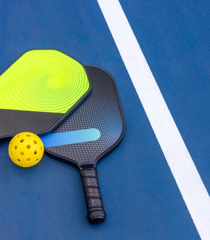 Pickleball paddle with a vibrant, custom design showcasing intricate details and a professional look