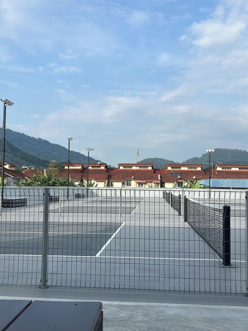 Scenic Pickleball Courts Outdoor pickleball courts with mountains and houses in the background