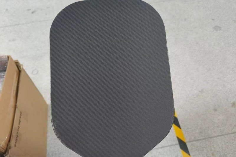 Carbon fiber paddle surface Close-up of a carbon fiber pickleball paddle surface