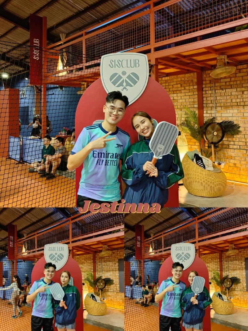 Club Pickleball Players Two smiling players holding pickleball paddles at indoor pickleball court