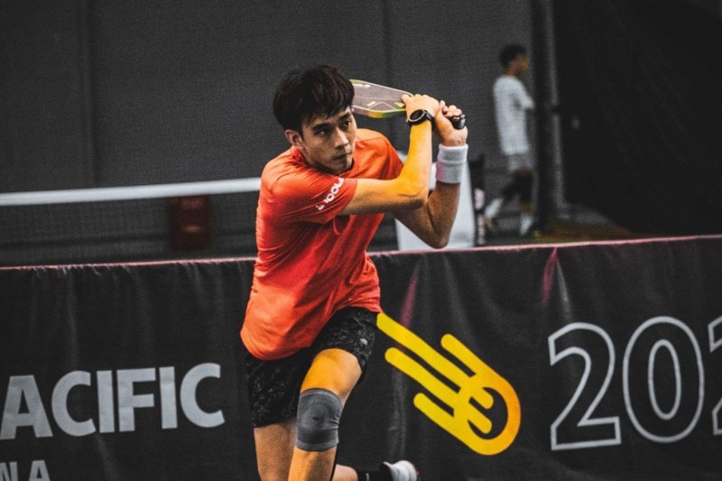 Pickleball tournament action Player hitting a pickleball shot in a tournament