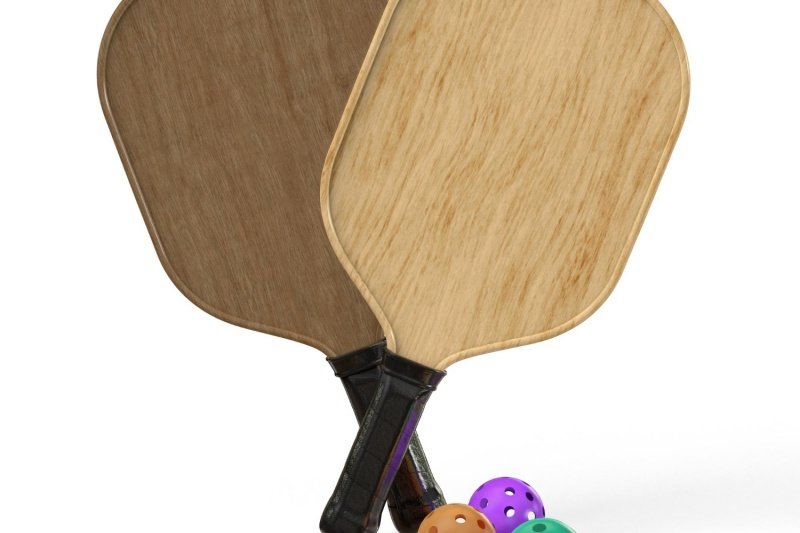 Wooden Paddles and Balls Two wooden pickleball paddles with colorful balls
